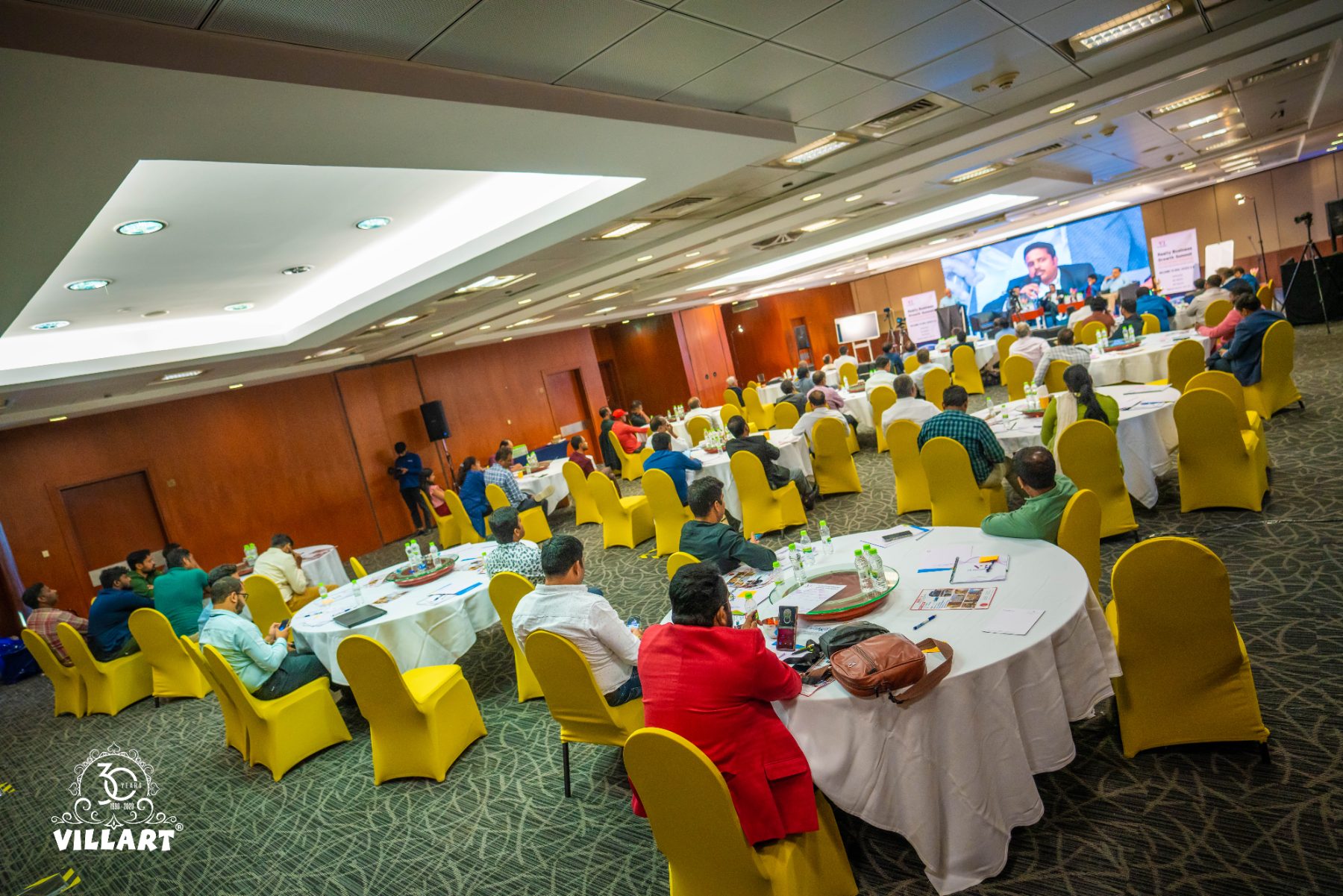 A banquet room set for a full-day program