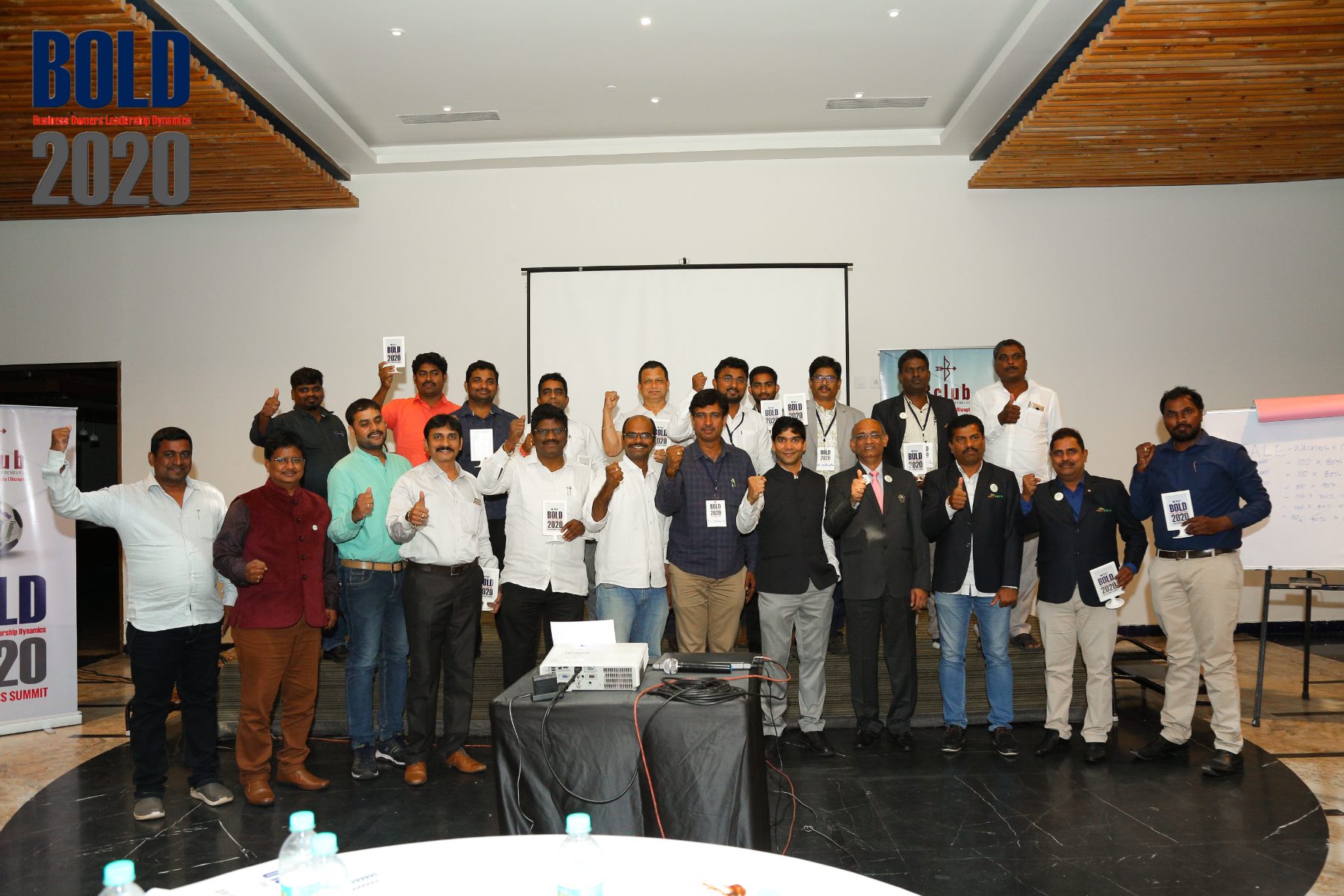 Participants on stage at the close of a program