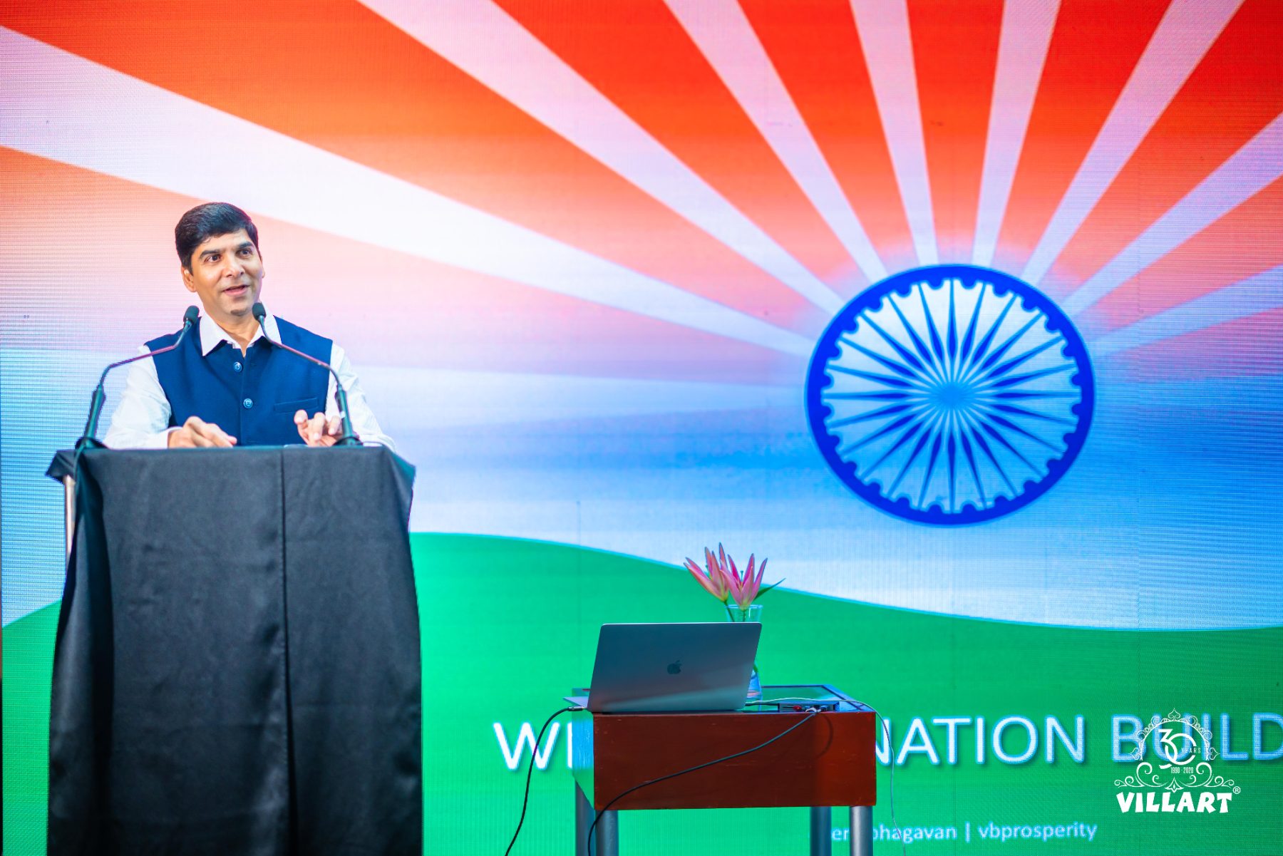 At the podium during a nation builders session